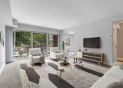 Thumbnail 3 of 31 - a living room with white furniture and a flat screen tv on the wall at Padonia Village Apartments, Timonium MD