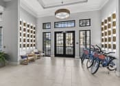 Thumbnail 34 of 38 - a group of bikes parked in the lobby of a building at Central Island Square, Daniel Island