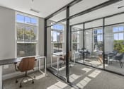 Thumbnail 26 of 38 - a conference room with glass doors and windows and desks at Central Island Square, Daniel Island, 29492