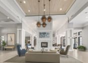 Thumbnail 31 of 38 - a lobby with couches and chairs and a fireplace at Central Island Square, Daniel Island, 29492