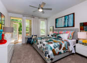 Thumbnail 4 of 30 - Bedroom with private patio access at Sycamore at Tyvola, Charlotte, North Carolina