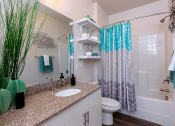 Thumbnail 13 of 30 - Bathroom with granite counters at Sycamore at Tyvola, Charlotte, 28217