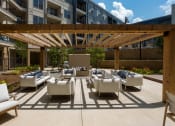 Thumbnail 3 of 26 - Courtyard Patio With Ample Sitting at Millworks Apartments, Georgia, 30318