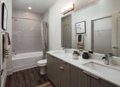 Thumbnail 17 of 26 - Large Soaking Tub With Tile Surround  at Millworks Apartments, Atlanta, GA, 30318