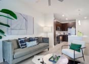 Thumbnail 7 of 26 - Living Room and Kitchen at Millworks Apartments, Georgia, 30318