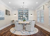 Thumbnail 32 of 33 - a dining room with a table and chairs and a tv at Sweetgrass Landing, Mount Pleasant, 29466
