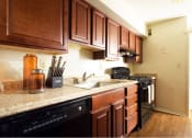 Thumbnail 6 of 12 - Spacious Kitchen with Pantry Cabinet at Brook View Apartments, Baltimore