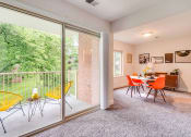 Thumbnail 13 of 31 - Dining Area and Balcony Renovated at Padonia Village Apartments, Timonium, MD, 21093