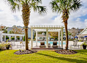 Thumbnail 12 of 26 - Pool with cabana seating at The Reserve at Mayfaire Apartments, Wilmington NC