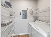 Thumbnail 9 of 33 - A laundry room with a washer and dryer and a door at Sweetgrass Landing, Mount Pleasant, South Carolina, 29466
