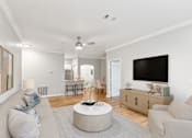 Thumbnail 4 of 33 - A living room with a grey couch and a round coffee table at Sweetgrass Landing, Mount Pleasant, South Carolina, 29466
