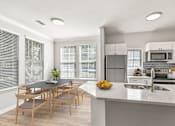 Thumbnail 12 of 33 - A modern kitchen with a dining table and chairs at Sweetgrass Landing, South Carolina, 29466