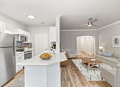 Thumbnail 10 of 33 - A modern kitchen with a refrigerator, stove, and oven at Sweetgrass Landing, Mount Pleasant, 29466