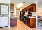 Thumbnail 17 of 41 - Washer And Dryer Attached Along With Kitchen Area at Westwinds Apartments, Annapolis, Maryland