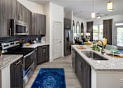 Thumbnail 2 of 27 - Gourmet Kitchen with Breakfast Bar and Pantry at The Flats at Ballantyne Apartments, Charlotte, 28277