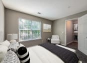 Thumbnail 8 of 20 - a bedroom with a large bed and a closet  at The Village Apartments, Raleigh, 27615