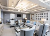 Thumbnail 26 of 33 - Community room with wine lockers and sofas at St Mary's Square North Apartments, Raleigh, NC, 27605
