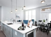 Thumbnail 42 of 64 - Kitchen And Dining at The Apartments at St. Marys, Raleigh, 27605