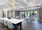 Thumbnail 31 of 33 - Web cafe terrace with tables and chairs  at St Mary's Square North Apartments, Raleigh, North Carolina