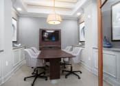Thumbnail 32 of 33 - Conference room with table and seating at St Mary's Square North Apartments, Raleigh