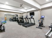 Thumbnail 33 of 33 - Fitness center with cardio equipment at St Mary's Square North Apartments, Raleigh, NC
