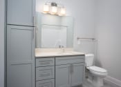 Thumbnail 23 of 33 - Guest bathroom with vanity and storage at St Mary's Square North Apartments, Raleigh, 27605