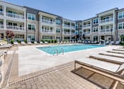 Thumbnail 11 of 27 - Sparkling Swimming Pool at The Flats at Ballantyne Apartments, Charlotte, North Carolina