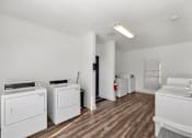 Thumbnail 20 of 62 - A laundry room with a washer and dryer.