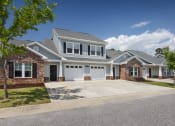 Thumbnail 6 of 50 - a white house with a garage and a driveway