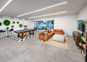 Thumbnail 44 of 57 - A room with a pool table and a couch.