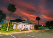 Thumbnail 7 of 36 - the front of our building at sunset with palm trees