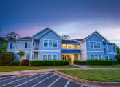 Thumbnail 4 of 36 - a blue house with a sidewalk in front of it