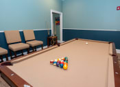Thumbnail 24 of 36 - a pool table with a bunch of balls on it