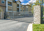 Thumbnail 18 of 91 - A gated entrance to a residential building.