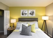 Thumbnail 28 of 39 - 1-, 2-, & 3-Bedroom Apartments In Vestavia Hills, AL - MarQ Vestavia - Bedroom With Closet, Carpet Flooring, Modern Decor, Bed With Pillows, Floor Lamp, And Circle Nightstand With Desk Lamp.