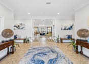 Thumbnail 17 of 35 - A large, open living room with a blue and white rug in the center.