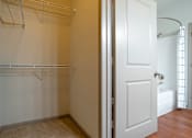 Thumbnail 86 of 91 - A white closet with a white door and a white towel hanging on the door.
