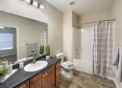 Thumbnail 40 of 50 - a bathroom with a sink and a shower and a toilet