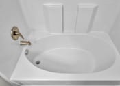 Thumbnail 54 of 91 - A white toilet with a gold flush handle.