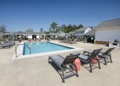 Thumbnail 8 of 50 - our apartments have a resort style pool and lounge chairs