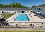 Thumbnail 22 of 46 - our apartments have a large pool and lounge chairs in the yard