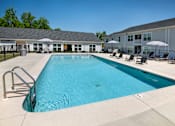 Thumbnail 24 of 46 - our apartments have a large swimming pool with chairs and umbrellas