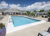 Thumbnail 9 of 50 - our resort style swimming pool is next to our building with lounge chairs and tables
