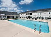 Thumbnail 27 of 46 - our apartments have a large swimming pool with chairs and umbrellas