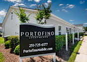 Thumbnail 46 of 46 - a white building with a sign apartments