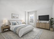Thumbnail 19 of 19 - A bedroom with a large bed, a nightstand with a lamp, and a flat-screen TV mounted on the wall.