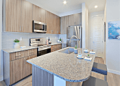 Thumbnail 24 of 73 - Fitted Kitchen With Island Dining at Scottsdale Hayden Townhomes, Scottsdale