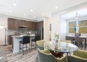 Thumbnail 9 of 73 - a kitchen and dining area in a 555 waverly unit at Scottsdale Hayden Townhomes, Arizona, 85257