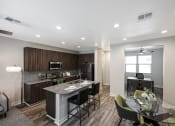 Thumbnail 12 of 73 - a kitchen and dining area in a 555 waverly unit at Scottsdale Hayden Townhomes, Scottsdale, AZ