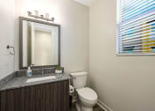 Thumbnail 56 of 73 - a bathroom with a toilet sink and mirror at Scottsdale Hayden Townhomes, Arizona, 85257